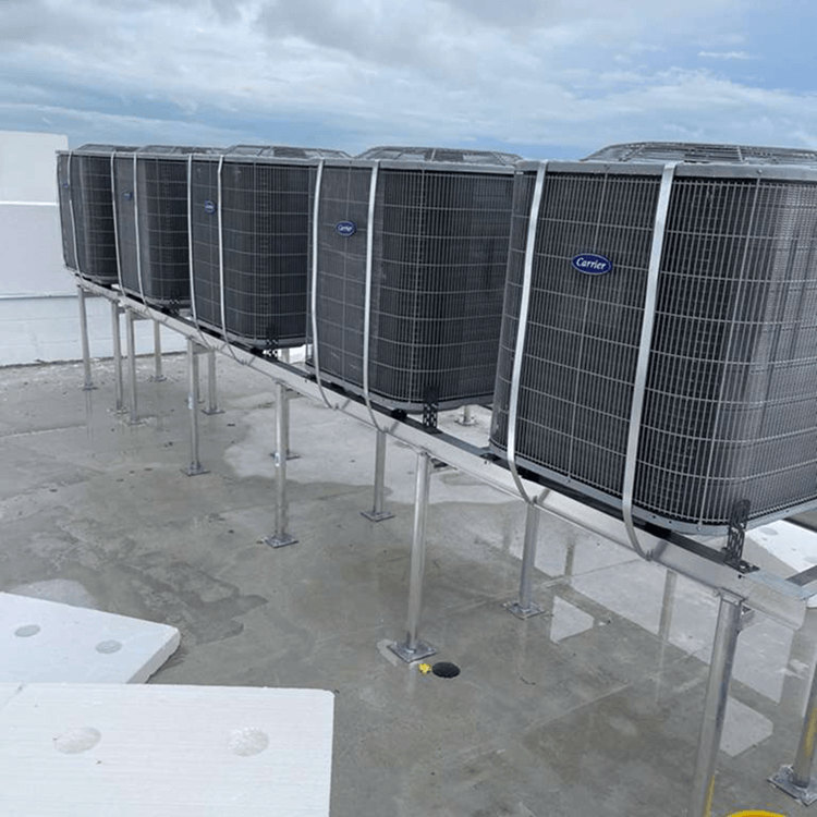 Hopeflex technician working on a rooftop HVAC unit in Miami